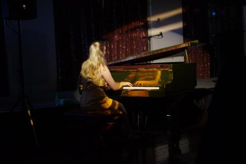 A pianist performs at the Solo Instrumental event